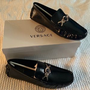 Black Versace loafers.